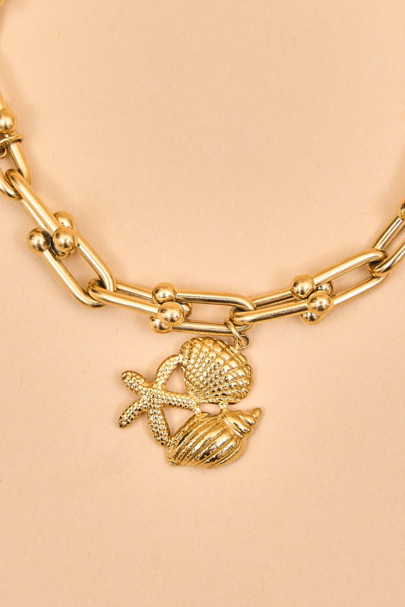 Gold charm bracelet with ocean - inspired accents. - Meiala Official