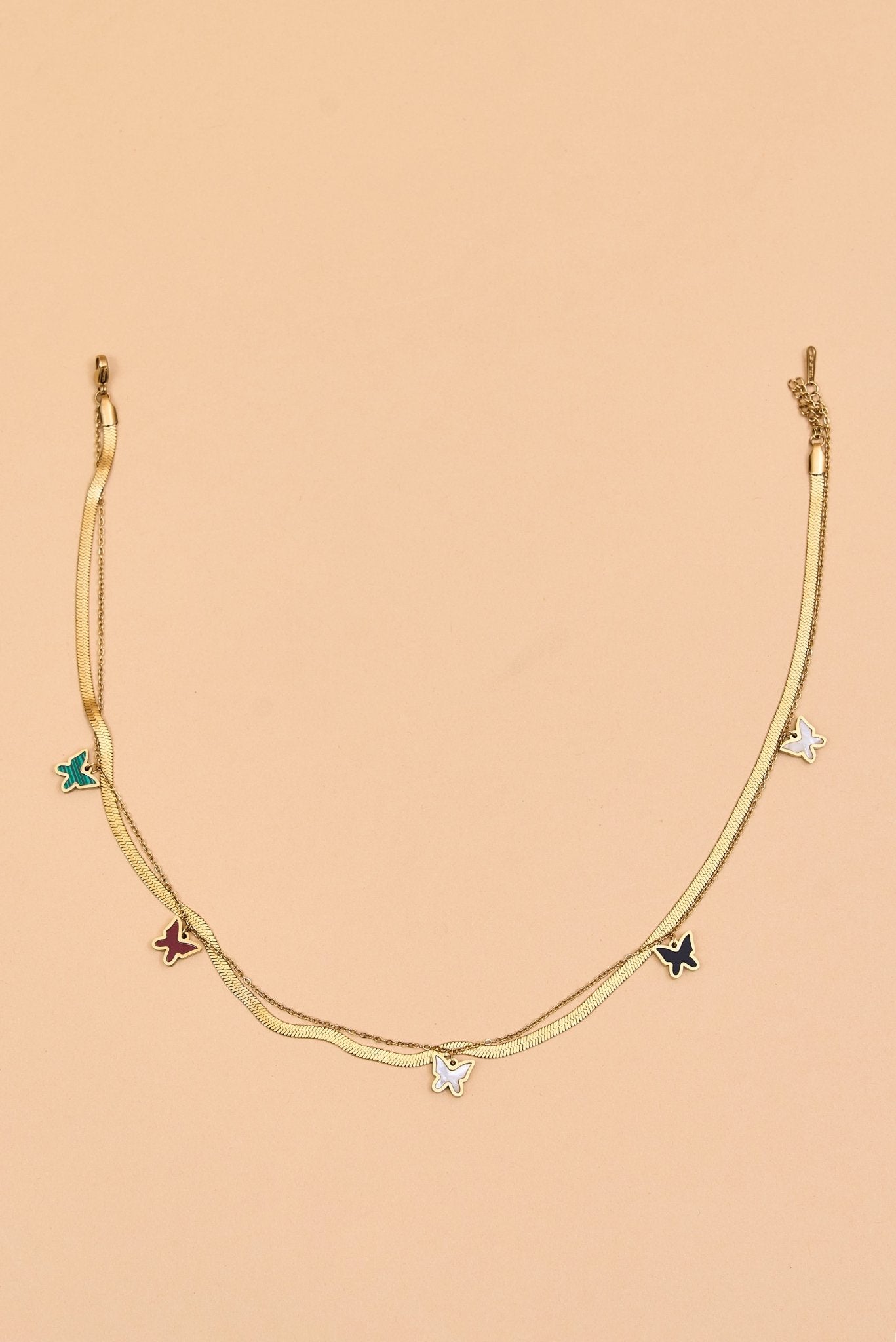 Gold layered necklace with star and hoop accents. - Meiala Official
