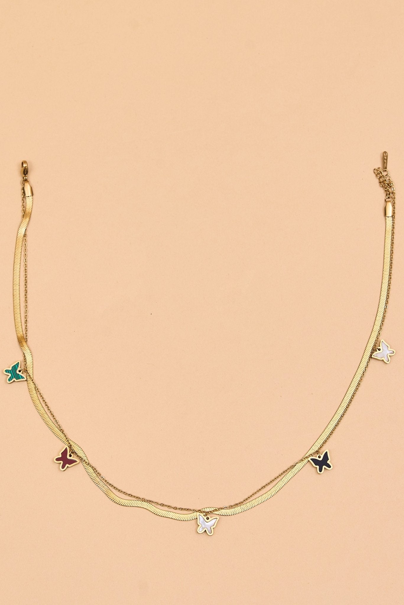 Gold layered necklace with star and hoop accents. - Meiala Official