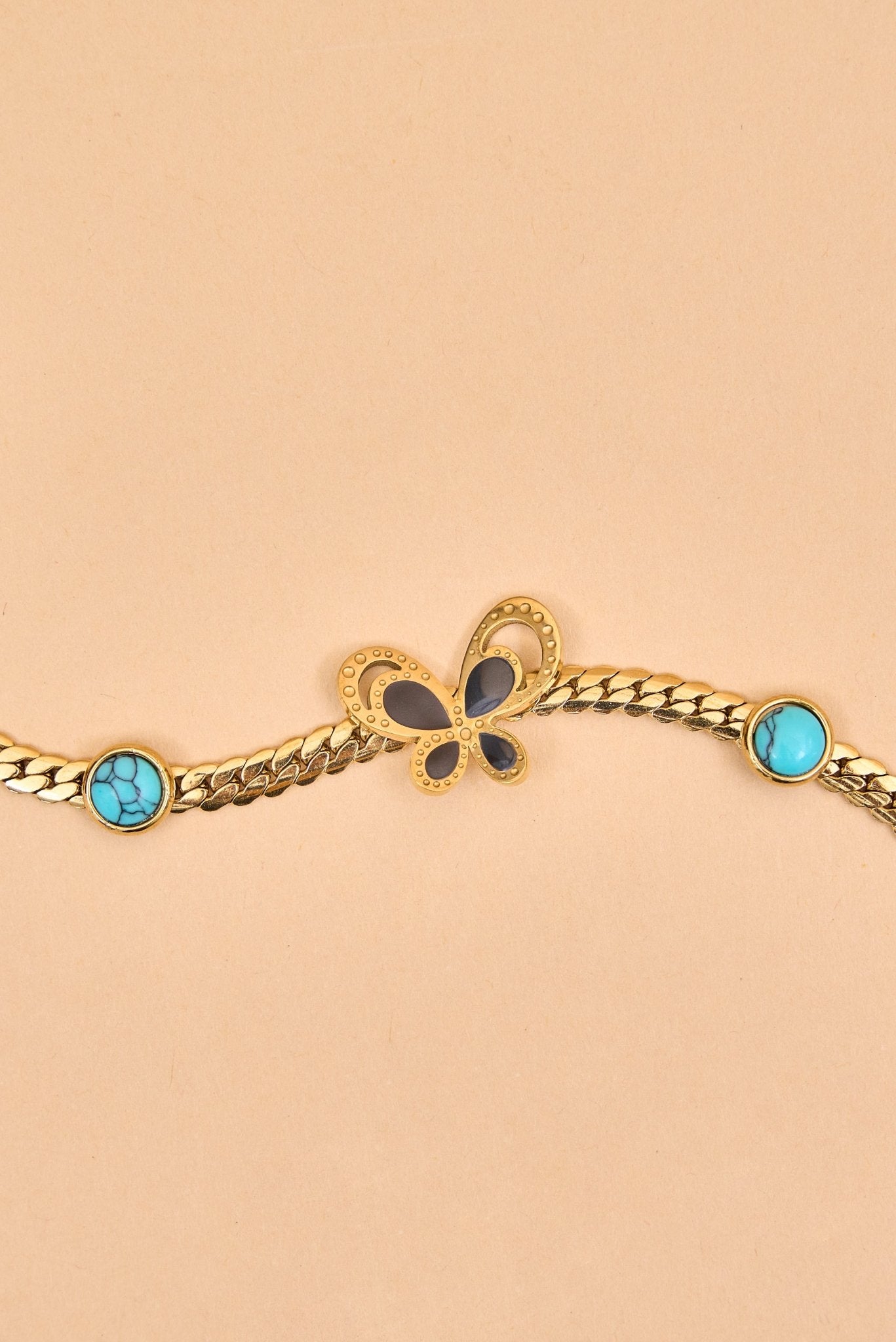 Sleek gold bracelet with butterfly center charm. - Meiala Official